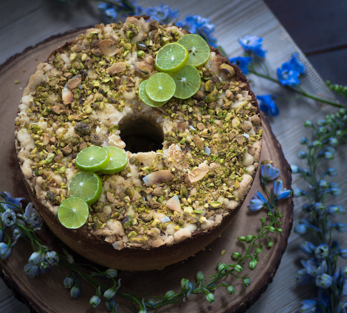 Recipe for Key lime coffee cake with a coconut and pistachio cream cheese layer topped with pistachio, lime streudel.